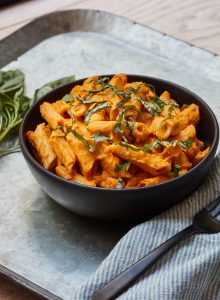 Butternut Squash Pasta served in black bowl on metal tray