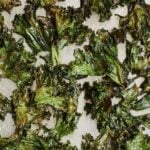 Pinterest graphic of a sheet pan of kale chips.