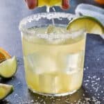Pinterest graphic of a lime being squeezed into a skinny margarita.