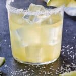 Pinterest graphic of a glass of skinny margarita with a lime wedge.