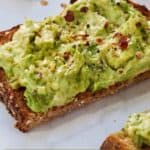 Pinterest graphic of a close up of half a slice of avocado toast.