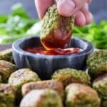 Pinterest graphic of a broccoli tot being dipped into ketchup.