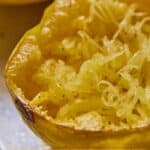Pinterest graphic of a close up of spaghetti squash.