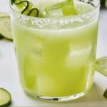 Pinterest graphic of a salt-rimmed glass of cucumber margarita.