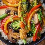 Pinterest graphic of an overhead view of a bowl of vegetable stir fry.