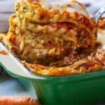 Pinterest graphic of a serving of vegetarian lasagna lifted from a green casserole dish.