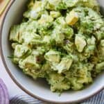 Pinterest graphic of the overhead view of a bowl of avocado egg salad.