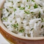 Pinterest graphic of a close up image of a bowl of cilantro lime rice.