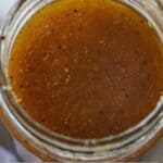 Pinterest graphic of a close up overhead view of a jar of balsamic vinaigrette.