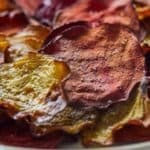 Pinterest graphic of the close up of a plate of beet chips.