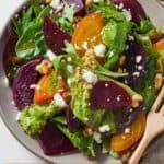 Pinterest graphic of a plate of beet salad over top of a linen napkin.