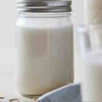 Pinterest graphic of a mason jar of oat milk.