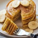 Pinterest graphic of a stack of pancakes with a wedge cut out, stuck on a fork.