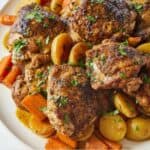Pinterest graphic of a platter of balsamic chicken over top of carrots and potatoes.