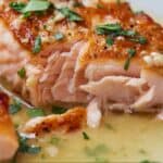 Pinterest graphic of the interior view of a pan seared salmon fillet.