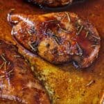 Pinterest graphic of a pan with three balsamic chicken breasts.