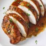 Pinterest graphic of a plate with a sliced serving of balsamic chicken.