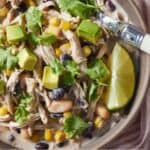 Pinterest graphic of a bowl of instant pot white chicken chili with a spoon inserted.