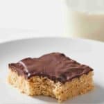 Pinterest graphic of a peanut butter rice krispie treat with a bite taken out.