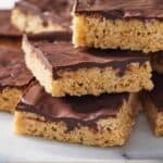 Pinterest graphic of a stack of peanut butter rice krispie treats.