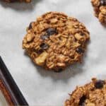 Pinterest graphic of banana oatmeal cookies on a parchment-lined sheet pan.