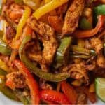 Pinterest graphic of a close up view of air fryer chicken fajitas.