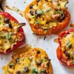 Pinterest graphic of a sheet pan with vegetarian stuffed peppers.