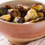 Pinterest graphic of a bowl of air fryer Brussels sprouts.