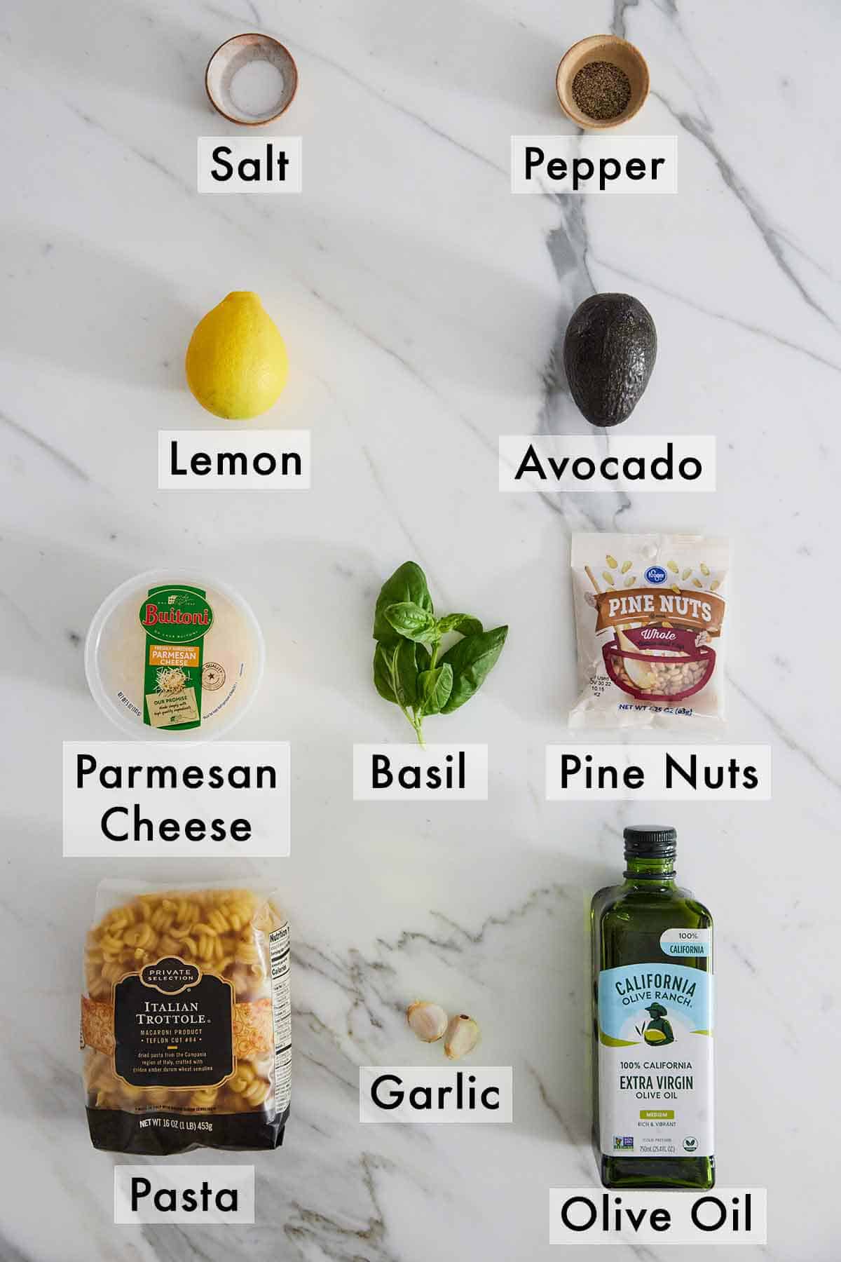 Ingredients needed to make avocado pesto pasta.