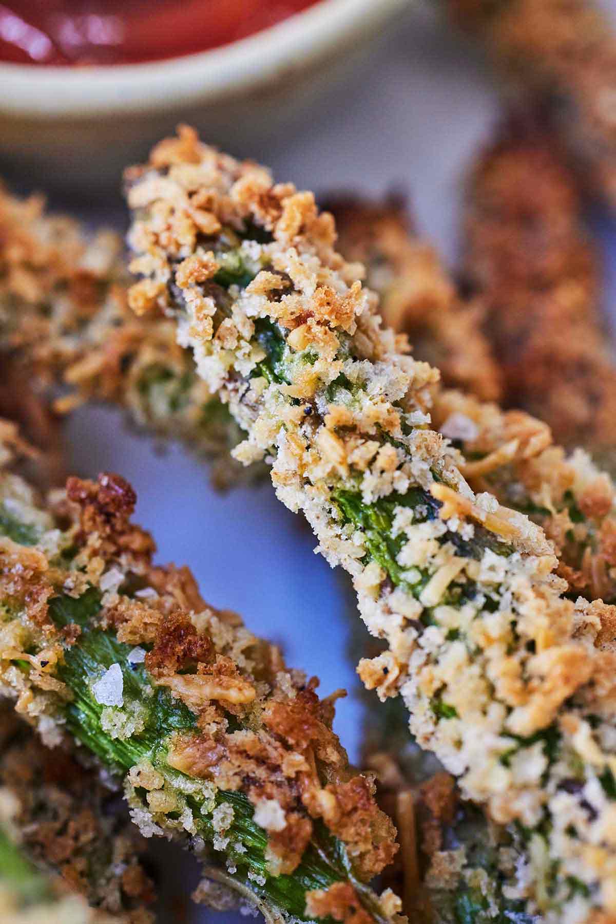 Close up of asparagus fries showing the crispy panko.