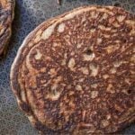 Pinterest graphic of a buckwheat pancake in a pan.