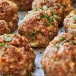 Pinterest graphic of a close up of multiple turkey meatballs in a profile view.
