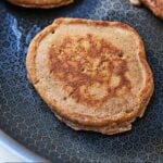 Pinterest graphic of a whole wheat pancake in a skillet.