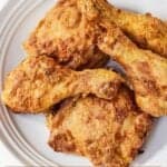 Pinterest graphic of a plate of air fryer fried chicken.