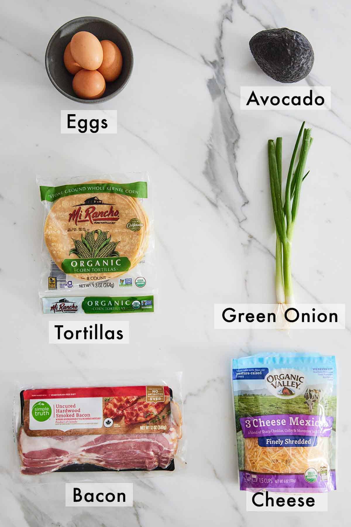 Ingredients needed to make breakfast tacos.
