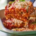 Pinterest graphic of a serving of vegan lasagna lifted from a baking dish.