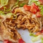 Pinterest graphic of a chicken chimichanga cut in half.