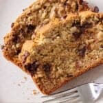 Pinterest graphic of two slices of gluten free chocolate chip banana bread with a fork beside it.