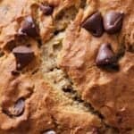 Pinterest graphic of a close view of the chocolate chips on the top of a gluten free chocolate chip banana bread.