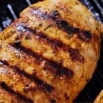 Pinterest graphic of a close view of a Mediterranean grilled chicken, showing the grill lines.
