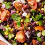 Pinterest graphic of a close view of a bowl of black bean salad.