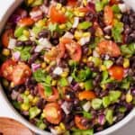 Pinterest graphic of an overhead view of a large bowl of black bean salad.