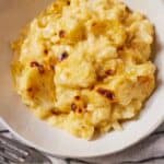 Pinterest graphic of a bowl of cauliflower mac and cheese.