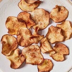 Overhead view of a plate of air fryer apple chips.