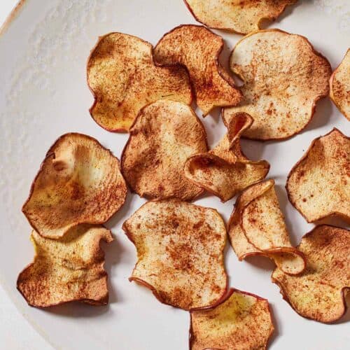 Overhead view of a plate with air fryer apple chips.