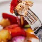 Pinterest graphic of a fork with a piece of chicken and bell pepper.