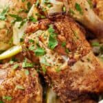 Pinterest graphic of a close view of air fryer Lebanese chicken with chopped parsley garnished on top.