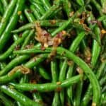 Pinterest graphic of a close view of crispy shallot green beans.