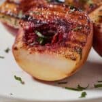 Pinterest graphic of a grilled peach with a portion sliced off.